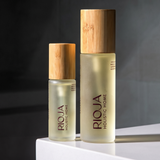 Lavender and Rosemary Body oil bottles with wooden cap on a dark background by Rioja Holistic Home