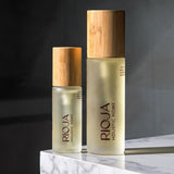 Lavender and Rosemary Body oil bottles with wooden cap on a dark background by Rioja Holistic Home