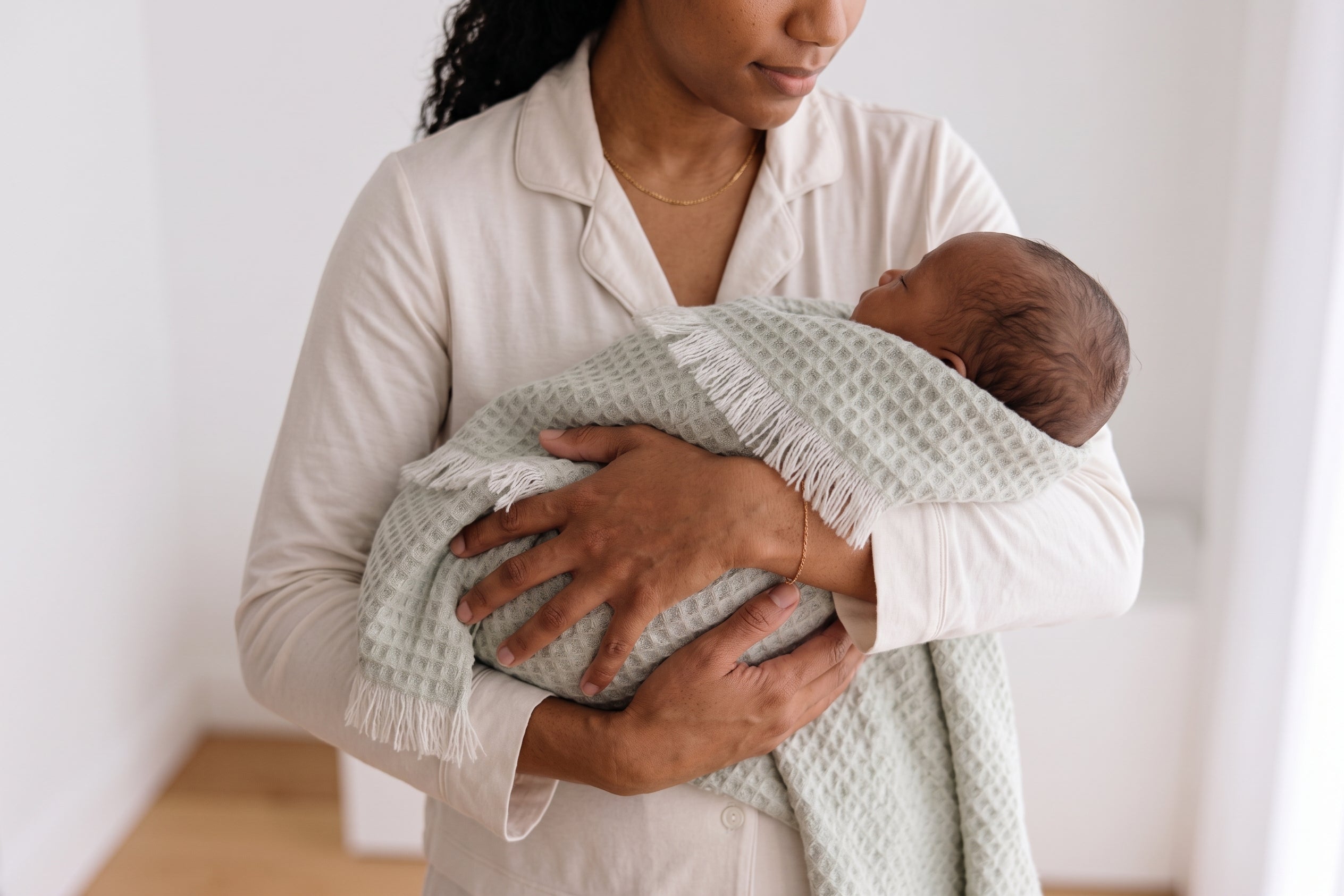 Sage textured 100% merino wool baby blanket with fringes