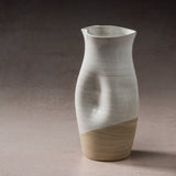 Ceramic JARRA pitcher with two-tone design on a neutral background