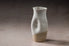Ceramic JARRA pitcher with two-tone design on a neutral background