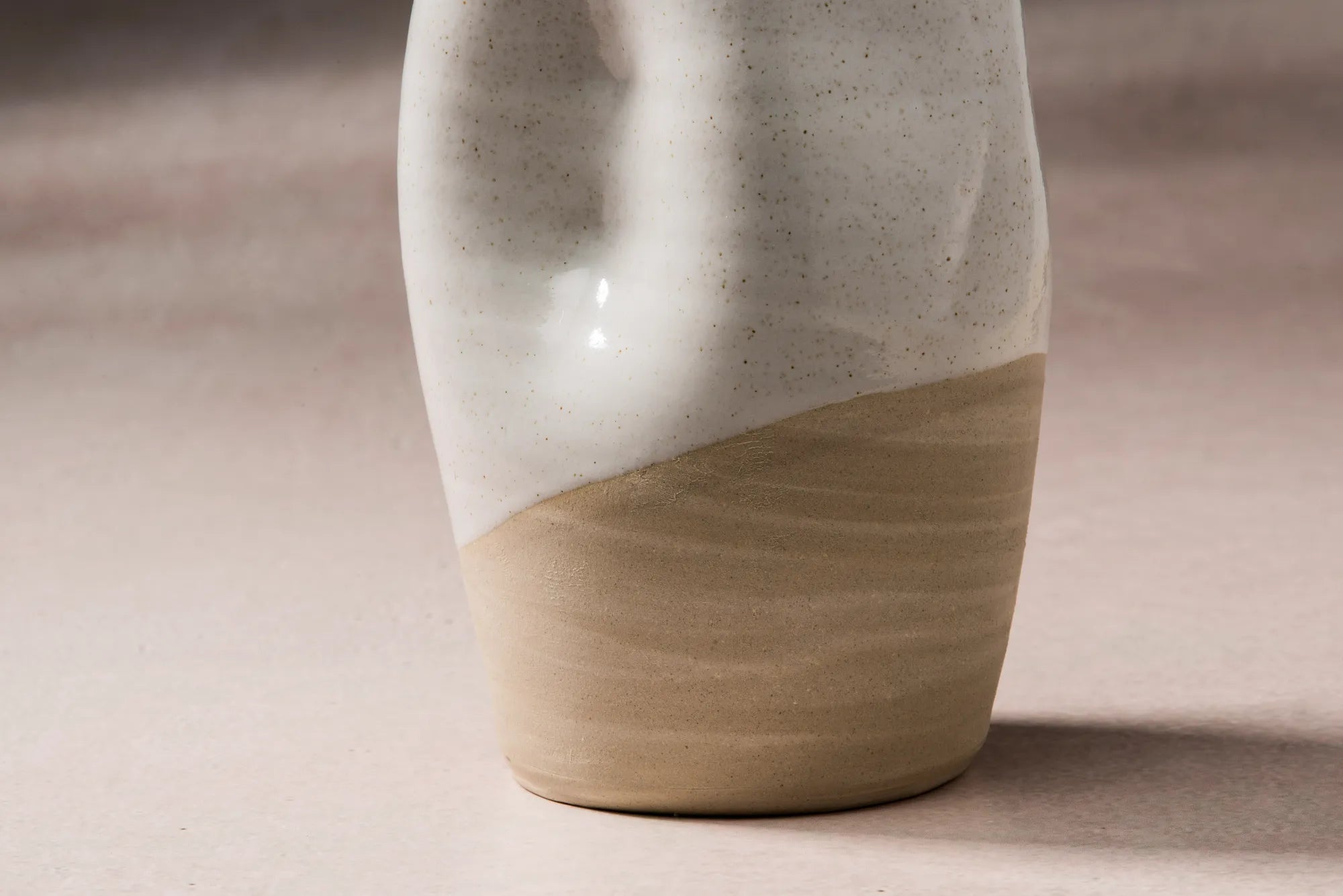 Ceramic Jarra pitcher with two-tone design on a neutral background