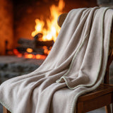 Wood chair with a beige 100% merino wool blanket