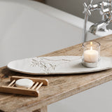 Decorative white plate with a small Blanko tray and decorative elements